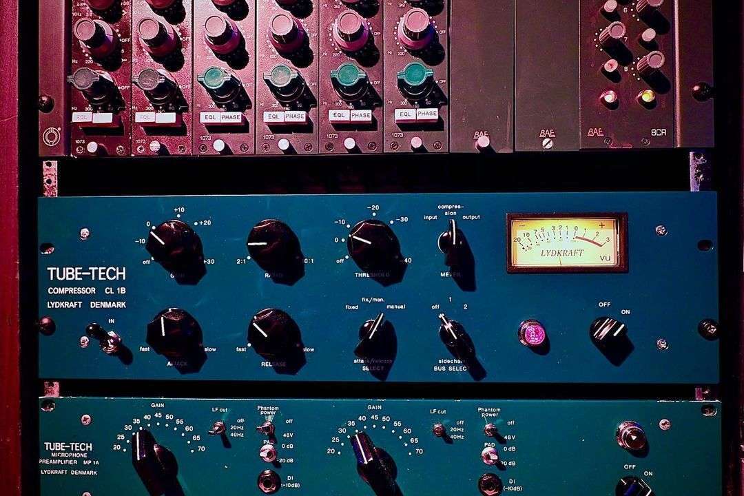 A rack of different types of equipment in a recording studio Neve 1073 and Tube Tech CL1b