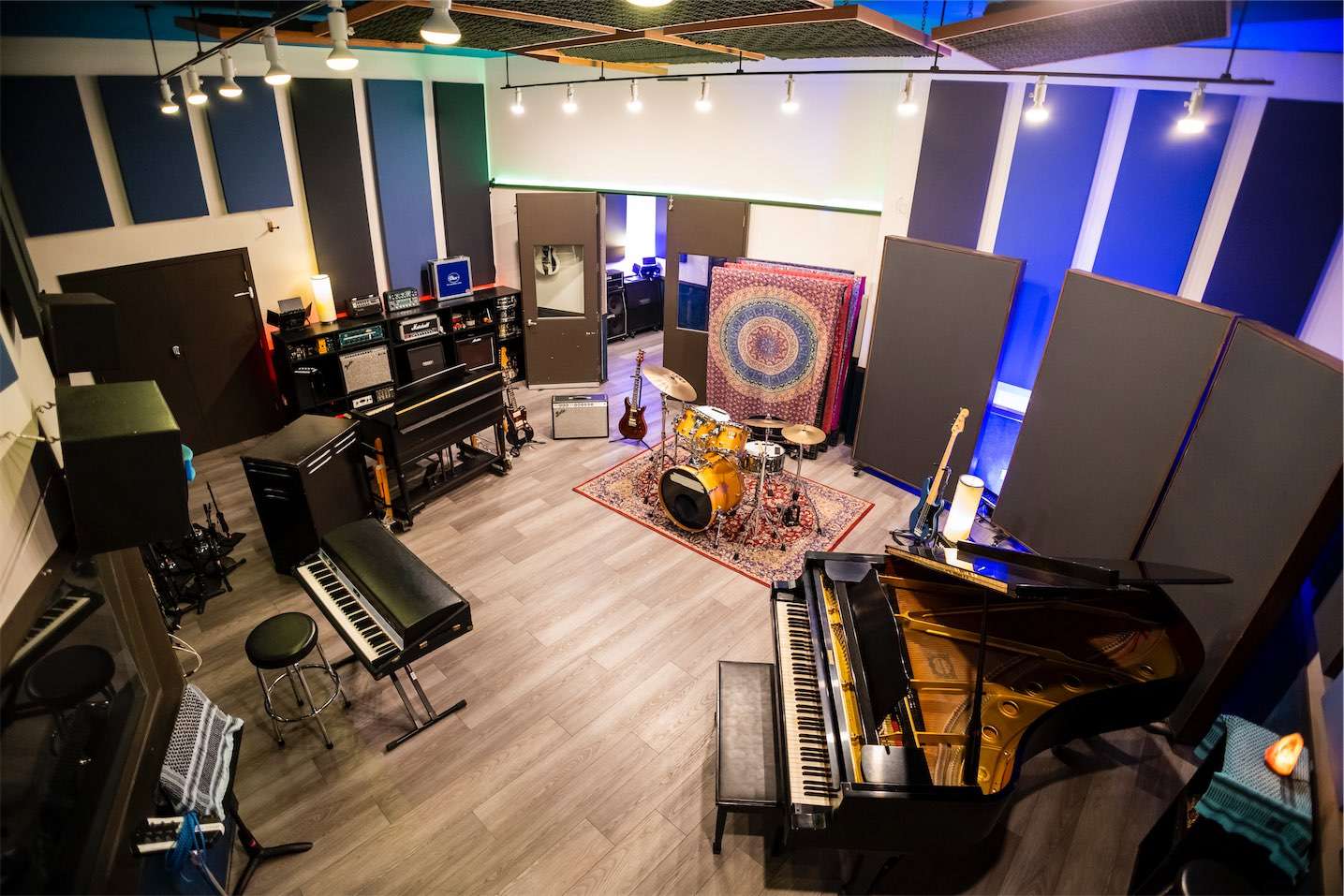 A recording studio in Los Angeles with a piano and other instruments.
